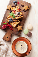 Coffee with waffles and sweets