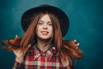 fashionable woman in a dark hat, stylish shirt