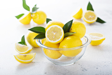 Fresh lemons in a glass bowl