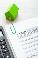 Paper house and tax form