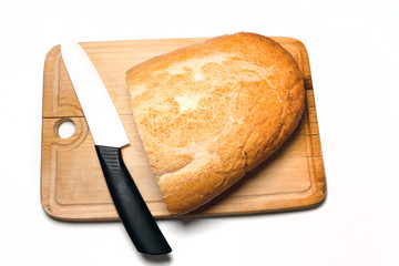 light bread and knife on cutting board isolated