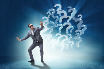 Blindfold businessman in incertainty concept