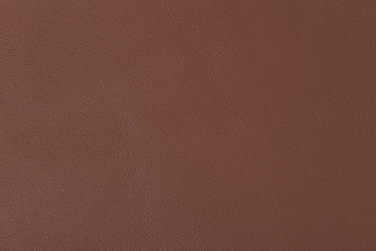 Macro shot of brown leather texture.