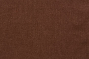 Dark brown textile background.