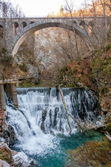 Waterfall under a bridge