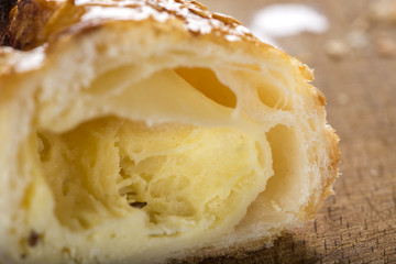 Interior of one cheese patty smeared with honey and sesame seeds