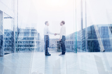 business deal or cooperation concept, two businessman handshake