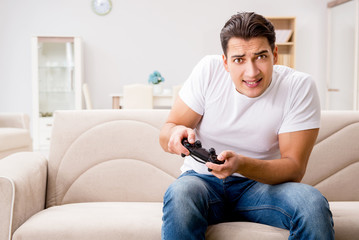Fototapeta premium Man addicted to computer games