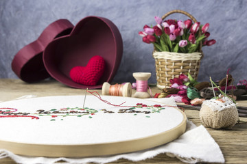 Valentine embroidery and equipment on wood table