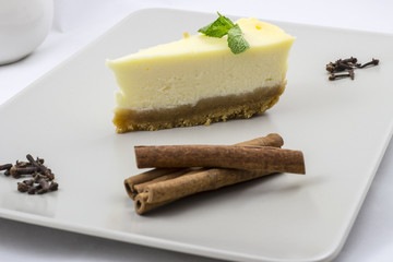 White chocolate cheesecake with mint and cinnamon