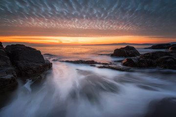 Fototapeta na wymiar Dawn among the rocks / Sea sunrise at the rocky Black Sea coast near Sozopol, Bulgaria