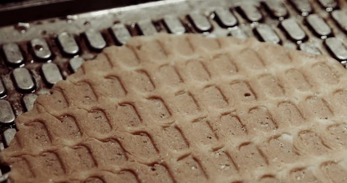 Waffle iron macro in the kitchen. Preparing homemade waffles wery closeup shot, vintage color