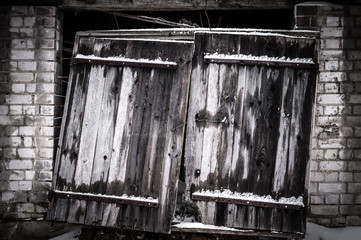 Old, broken, wooden gate door