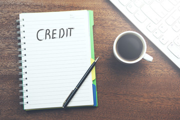 Credit  text written on a notebook.