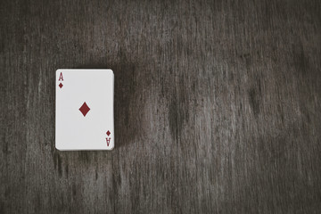 ace of diamonds. playing cards on a wooden background. Risk and Gambling background, abstract.