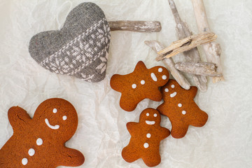 Gingerbread man cookies on the decorated table