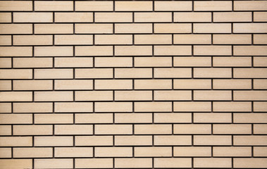 Obraz premium Bricks wall, fence, texture. Decorative yellow blocks wallpaper