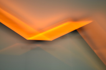 Abstract orange and gray fluorescent light background motion blur effect