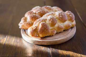 Challah bread on wooden table