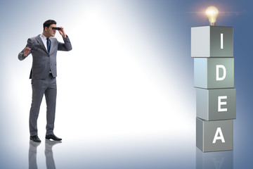 Fototapeta premium Businessman looking for bright ideas