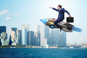 Fototapeta na wymiar Businessman flying on rocket in business concept