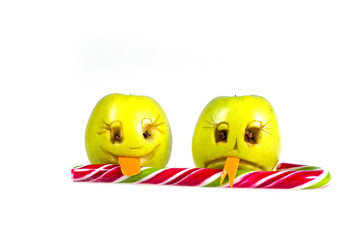 Happy and sad emoticons apple licking a lollipop. Feelings, attitudes and emotions.