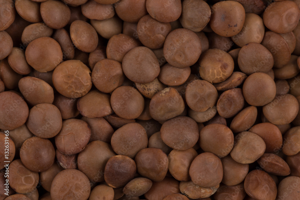 Wall mural brown lentils close up