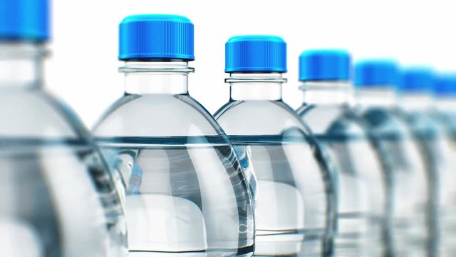 Row of plastic drink water bottles