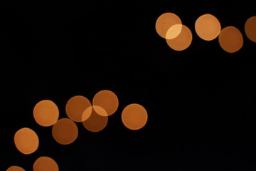 Spotted background of group of orange circles on black