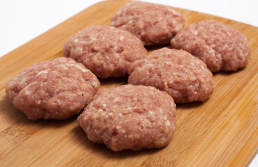 raw meatballs on board