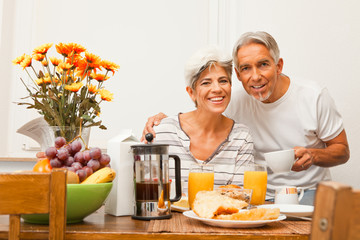 Happy Senior Couple Having Breakfast