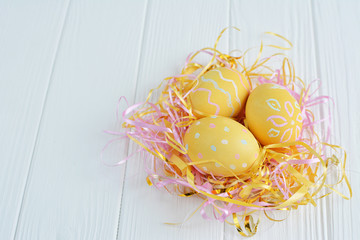 Easter eggs painted in pastel colors on a white background