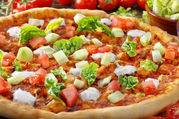 Fresh homemade pizza with chicken and garlic sauce