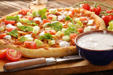 Fresh homemade pizza with chicken and garlic sauce