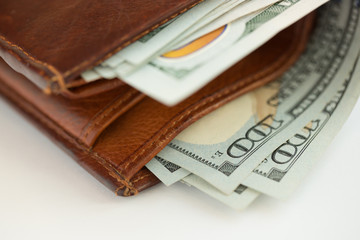Brown leather wallet with USA dollars money