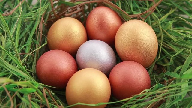 Golden Easter eggs on grass