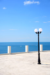 Street lamp on the sea promenade on clear sunny day, Anapa, Krasnodar region, Russia