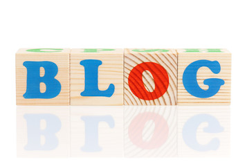 Blog word formed by colorful wooden alphabet blocks, isolated on white background 
