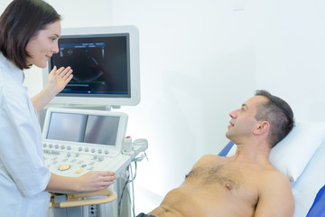 Nurse explaining scan results to patient