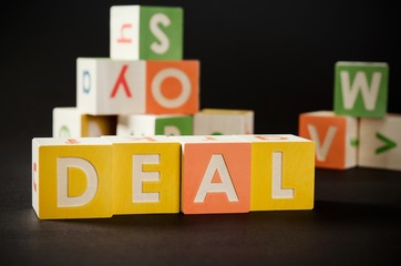 DEAL word with colorful blocks.
