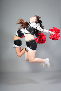 Two Cheerleaders Jumping