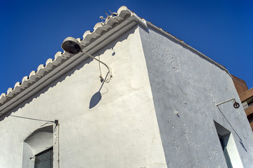 White building facade. Old Mediterranean residential house. Valencia, Spain