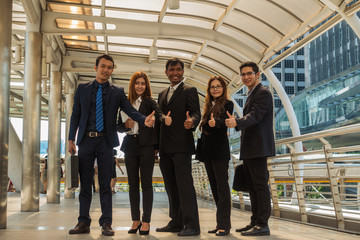 Five asian business teamwork with a group of people with a smile