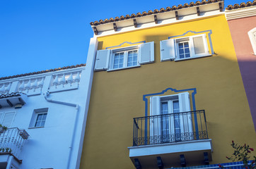 Fototapeta na wymiar Colorful building facade. Mediterranean residential houses in Little Venice. Port Saplaya,Alboraya, Valencia,Spain.