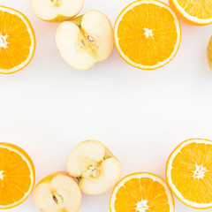 Orange and apple. White Background. Flat lay