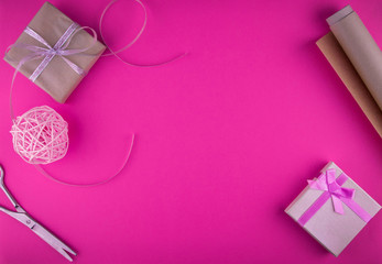 Valentines day gift wrapping on pink background.