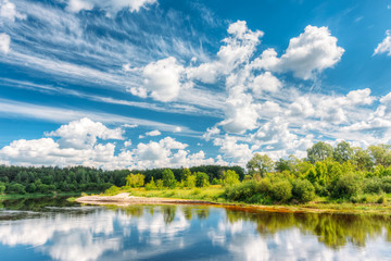 Obraz premium River Landscape With Reflections Of Clouds And Woods In Water. Summer