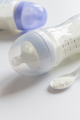 preparation of mixture baby feeding on white background