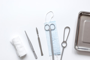 instruments for plastic surgery on white background top view