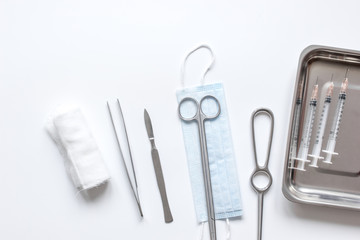 instruments for plastic surgery on white background top view